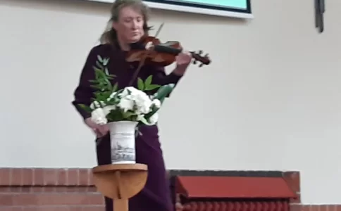 A violinist performing in church.