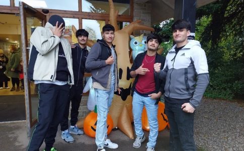 Group of young people by Halloween display at Poole's Cavern, Buxton.