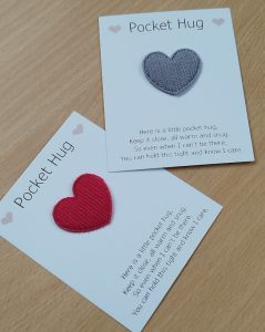 Two small cards with heart-shaped woollen attachments.