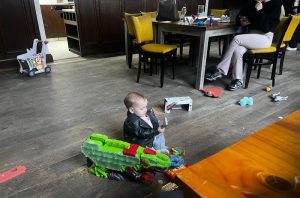 Young child playing on floor.