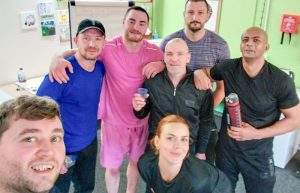 A group of people dressed for a fitness class.