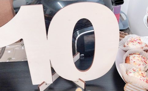 The figure 10 on a party table of cakes.